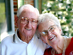 Photo of a couple smiling. 